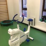 White Monark bike and mini trampoline ready to be used at physiotherapy gym placed at the Royal Blackburn Hospital.