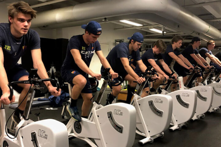 Ice hockey team training on Monark bikes