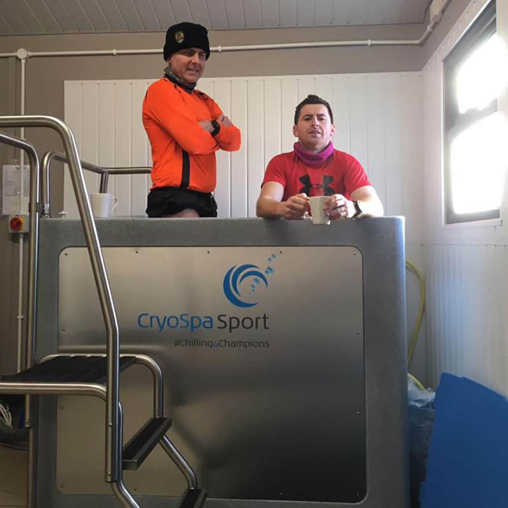two men in cryospa ice bath for recovery session