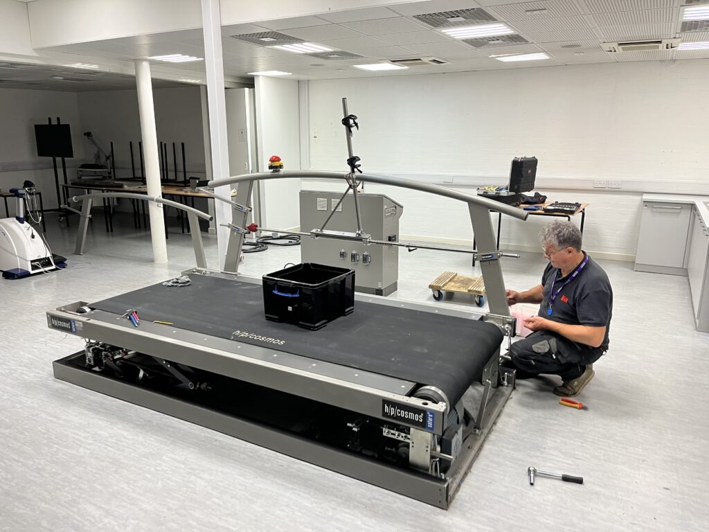 Pete disassembles the treadmill for transportation