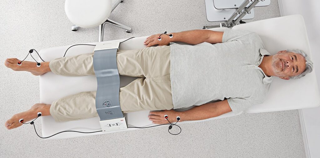 Patient receiving Bioelectrical Impedance Analysis (BIA) to assess body composition