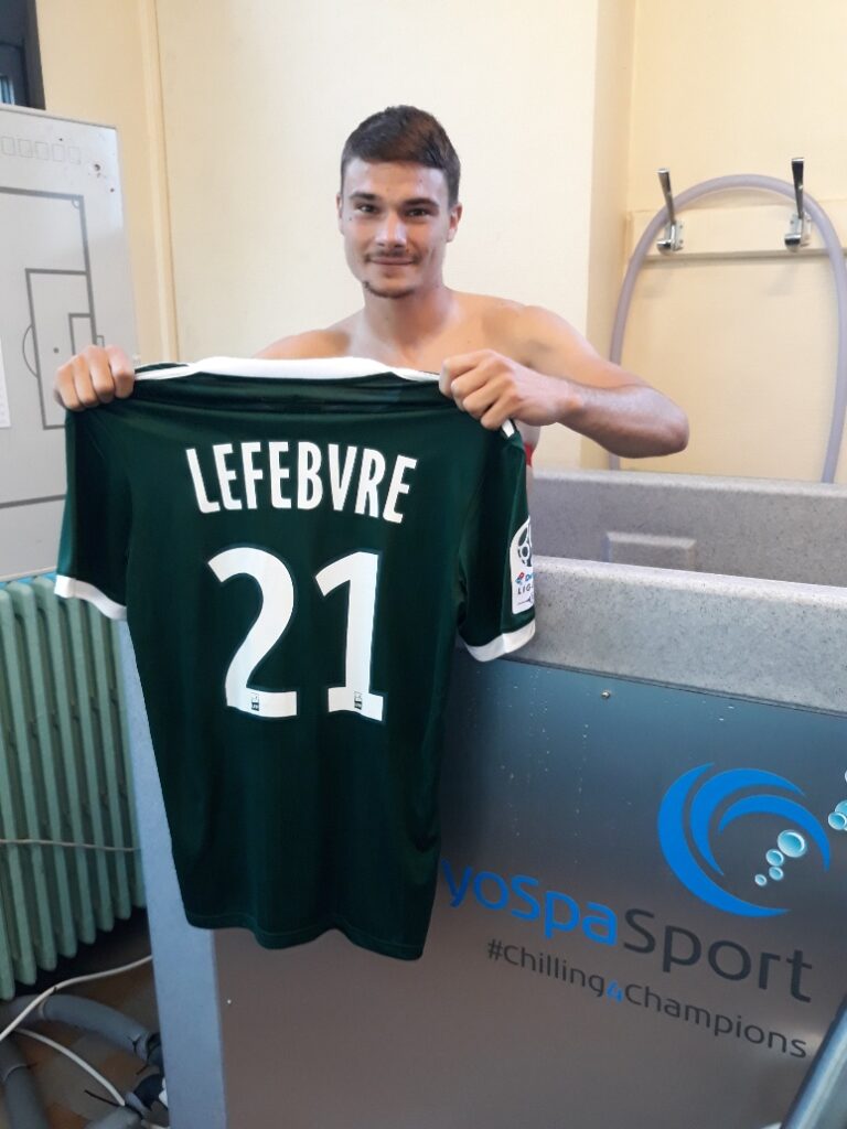 Footballer standing in CryoSpa Sport Ice Bath.